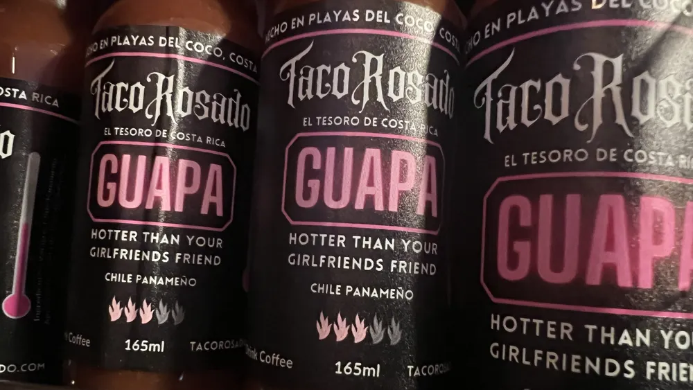 Bottles of Taco Rosado Guapa Hot Sauce from the official live menu